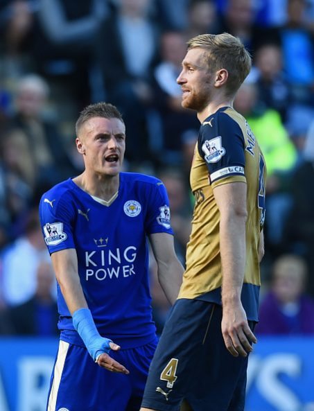 Would Arsenal have to alter their playing style to fit Jamie Vardy? 2 LEICESTER, ENGLAND - SEPTEMBER 26: Jamie Vardy of Leicester City and Per Mertesacker of Arsenal argue during the Barclays Premier League match between Leicester City and Arsenal at The King Power Stadium on September 26, 2015 in Leicester, United Kingdom. (Photo by Michael Regan/Getty Images)