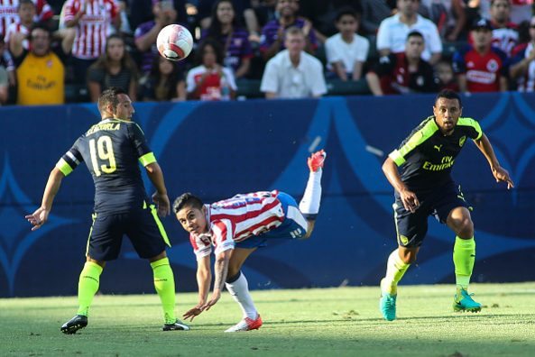The four positions Arsenal need to strengthen in the summer 5 Chivas Guadalajara midfielder Javier Eduardo Lopez (C) defended by Arsenal midfielders Santi Cazorla (L)and Francis Coquelin (R) during their friendly soccer match at StubHub Center in Carson, California on July 31, 2016. Arsenal won 3-1. / AFP / RINGO CHIU