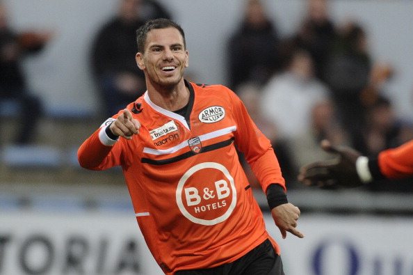 Lorient French forward Jeremie Aliadiere (R) celebrates with his teammate Lorient's forward Vincent Aboubakar after scoring a goal during the Frenc...