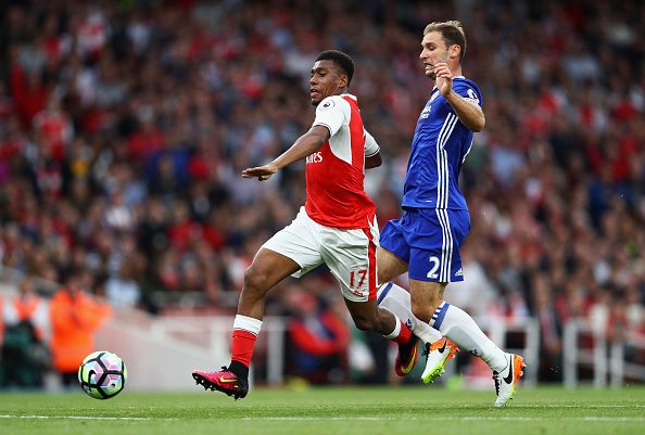 LONDON, ENGLAND - SEPTEMBER 24: Alex Iwobi of Arsenal (L) is fouled by Branislav Ivanovic of Chelsea (R) during the Premier League match between Arsenal and Chelsea at the Emirates Stadium on September 24, 2016 in London, England. (Photo by Paul Gilham/Getty Images)