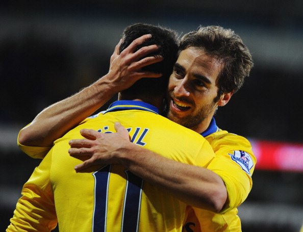 CARDIFF, WALES - NOVEMBER 30: Mathieu Flamini of Arsenal (R) celebrates with Mesut Oezil as he scores their second goal during the Barclays Premier...