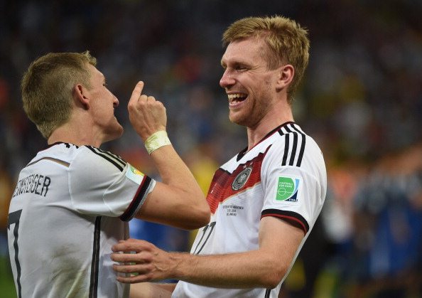 Per Mertesacker and Bastian Schweinsteiger