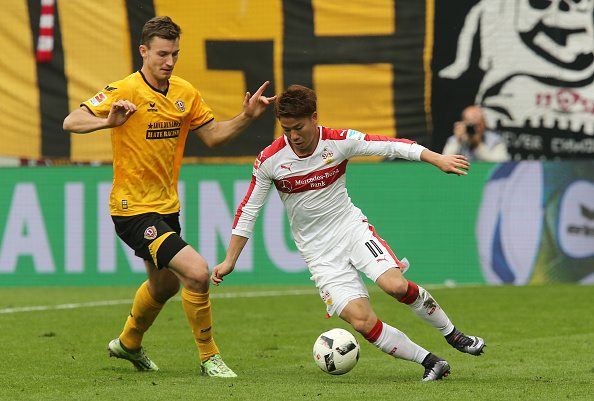 DRESDEN, GERMANY - OCTOBER 15: Florian Ballas (L) of Dresden battles for the ball with Takuma Asano (R) of Stuttgart during the Second Bundesliga match between SG Dynamo Dresden and VfB Stuttgart at DDV-Stadion on October 15, 2016 in Dresden, Germany. (Photo by Matthias Kern/Bongarts/Getty Images)