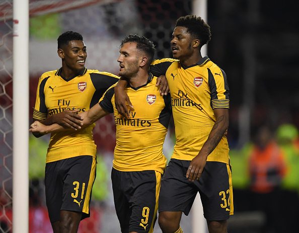 NOTTINGHAM, ENGLAND - SEPTEMBER 20: Lucas Perez (C) of Arsenal celebrates scoring his team's third goal with Jeff Reine-Adelaide (L) and Chuba Akpo...