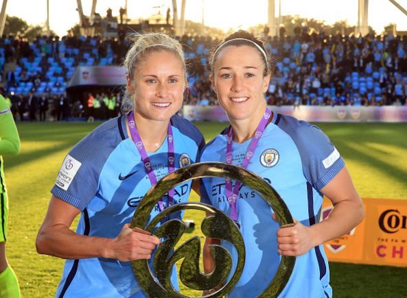 MANCHESTER, ENGLAND - OCTOBER 02: Steph Houghton (L) captain of Manchester City Women lifts the trophy and celebrates with her team-mate Lucy Bronze after winning the Continental Cup Final between Manchester City Women and Birmingham City Ladies at The Academy Stadium on October 2, 2016 in Manchester, England. (Photo by Clint Hughes/Getty Images)