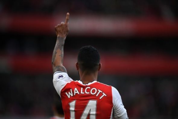 Arsenal's English midfielder Theo Walcott celebrates scoring the opening goal of the English Premier League football match between Arsenal and Swan...