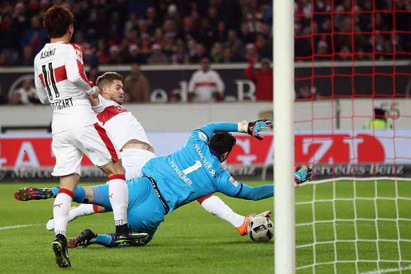 STUTTGART, GERMANY - DECEMBER 12: Simon Terodde of Stuttgart scores his team's first goal against goalkeeper Philipp Tschauner of Hannover during the Second Bundesliga match between VfB Stuttgart and Hannover 96 at Mercedes-Benz Arena on December 12, 2016 in Stuttgart, Germany. (Photo by Alex Grimm/Bongarts/Getty Images)