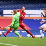 LIVERPOOL, ENGLAND - OCTOBER 17: Virgil van Dijk of Liverpool is tackled by Jordan Pickford of Everton which led to Virgil van Dijk being substituted for an injury during the Premier League match between Everton and Liverpool at Goodison Park on October 17, 2020 in Liverpool, England. Sporting stadiums around the UK remain under strict restrictions due to the Coronavirus Pandemic as Government social distancing laws prohibit fans inside venues resulting in games being played behind closed doors. (Photo by Laurence Griffiths/Getty Images)