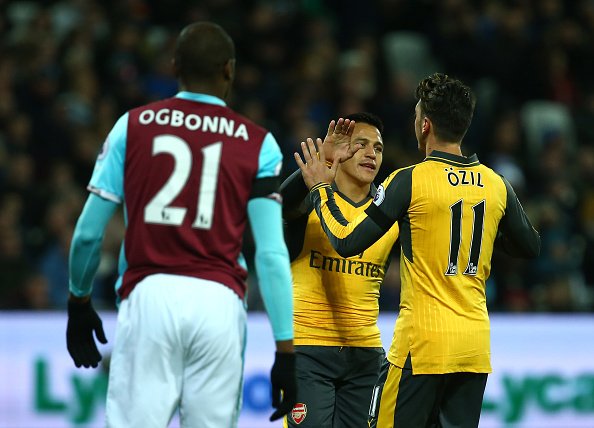 Player focus: Alexis Sanchez superb and influential as usual against West Ham 2 LONDON, ENGLAND - DECEMBER 03: Mesut Ozil of Arsenal celebrates with team-mate Alexis Sanchez after scoring the opening goal during the Premier League match between West Ham United and Arsenal at London Stadium on December 3, 2016 in London, England. (Photo by Charlie Crowhurst/Getty Images)