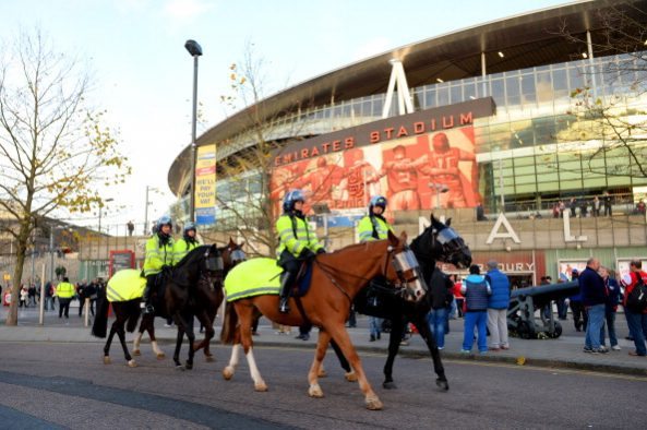 LONDON, ENGLAND - DECEMBER 08: Mounted police ride past the stadium ahead of the Barclays Premier League match between Arsenal and Everton at Emira...