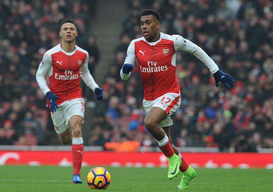 Iwobi (pictured, right) with possession at his feet, in action against Hull