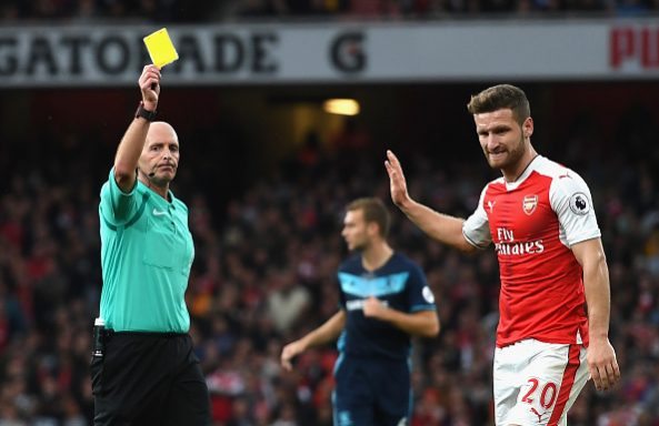Mike Dean books Shkodran Mustafi