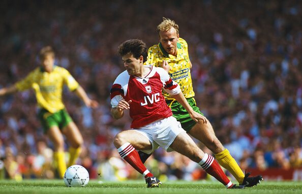 Ex-Arsenal star humiliated after £200k time travel TV prank 4 LONDON, UNITED KINGDOM - AUGUST 15: Arsenal wing Anders Limpar holds off the challenge of Jeremy Goss during a FA Premier League match between Arsenal and Norwich City at Higbury on August 15, 1992 in London, England. (Photo by Ben Radford/Allsport/Getty Images)