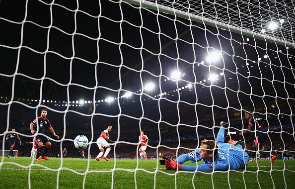 Neuer makes an excellent reaction stop to deny Walcott from close-range last season