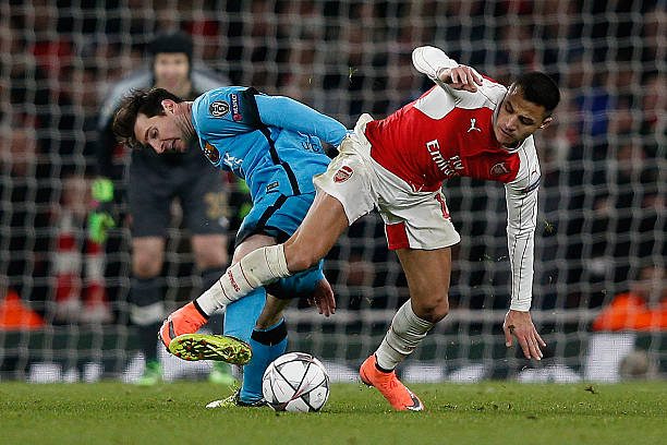 Alexis praise for Messi comes at the wrong time 2 Alexis (R) in action against former teammate Messi during last season's Champions League last-16 tie