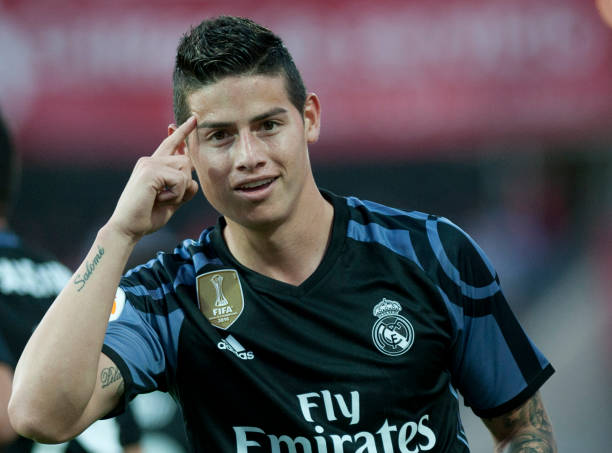 Real Madrid's Colombian midfielder James Rodriguez celebrates after scoring a goal during the Spanish league football match Granada FC vs Real Madr...