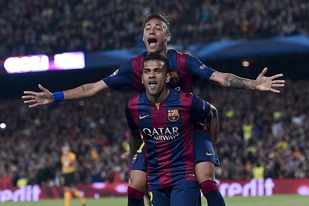 Barcelonas Brazilian forward Neymar da Silva Santos Junior Up celebrates with his teammate Barcelonas Brazilian defender Dani Alves