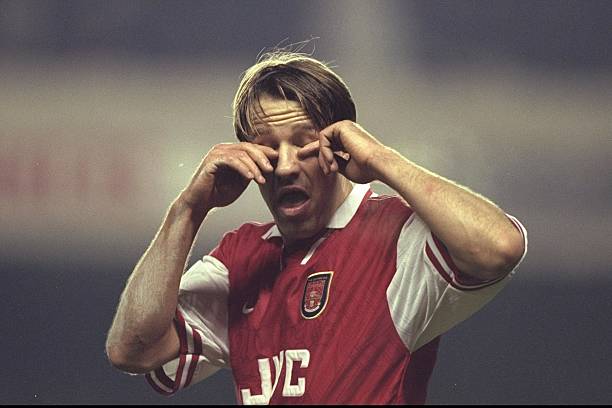 8 Dec 1996: Paul Merson of Arsenal rubs his eyes, during the FA Carling Premier league match between Arsenal and Derby County at Highbury in London...