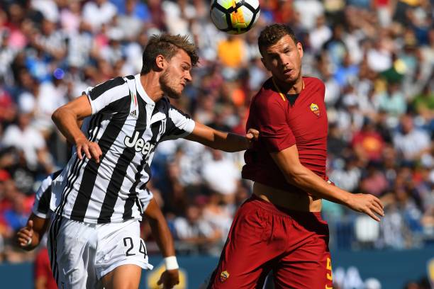 Roma Edin Dzeko drives against Juventus F.C Daniele Rugani during their 2017 International Champions Cup match at Gillette Stadium in Foxborough, M...