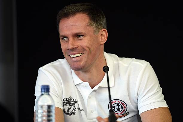 Former Liverpool player Jamie Carragher attends a press conference with Liverpool's English captain and midfielder Steven Gerrard (not pictured) at...
