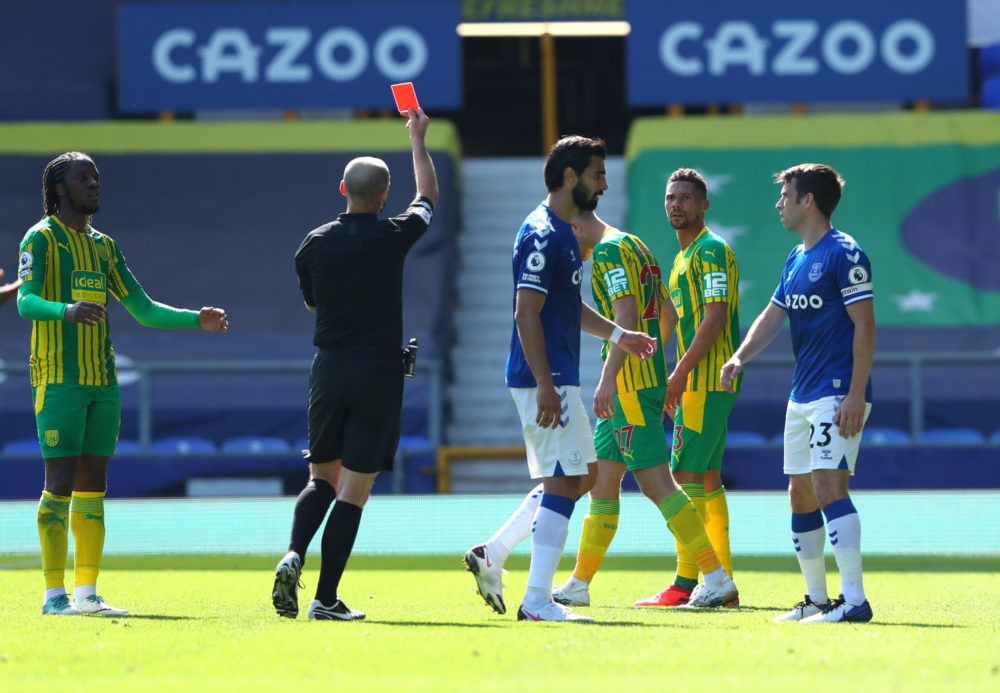 LIVERPOOL, ENGLAND - SEPTEMBER 19: Kieran Gibbs of West Bromwich Albion is shown the red card by Match Referee Mike Dean during the Premier League ...