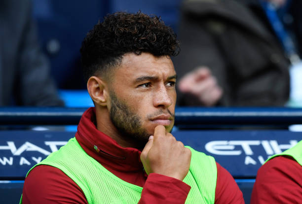 MANCHESTER, ENGLAND - SEPTEMBER 09: Alex Oxlade-Chamberlain of Liverpool looks on from the bench during the Premier League match between Manchester...