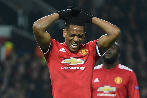 Manchester United's French striker Anthony Martial reacts after having his penalty kick saved during the UEFA Champions League Group A football mat...