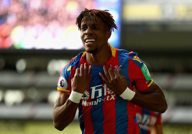 LONDON, ENGLAND - OCTOBER 28: Wilfried Zaha of Crystal Palace celebrates scoring his sides second goal during the Premier League match between Crys...