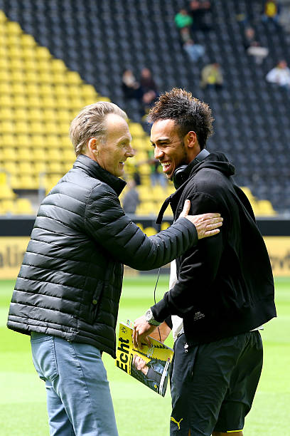 DORTMUND, GERMANY - MAY 09: (L-R) Hans Joachim Watzke, chairman of the board welcomes Pierre-Emerick Aubameyang of Dortmund prior to the Bundesliga match between Borussia Dortmund and Hertha BSC Bwerlin at Signal Iduna Park on May 9, 2015 in Dortmund, Germany. (Photo by Christof Koepsel/Bongarts/Getty Images)