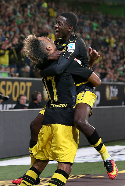 3 reasons why Ousmane Dembele won't sign for Arsenal 2 WOLFSBURG, GERMANY - SEPTEMBER 20: Pierre-Emerick Aubameyang (L) of Dortmund celebrates after scoring his team's second goal with Ousmane Dembele (R) of Dortmund during the Bundesliga match between VfL Wolfsburg and Borussia Dortmund at Volkswagen Arena on September 21, 2016 in Wolfsburg, Germany. (Photo by Ronny Hartmann/Getty Images For MAN)