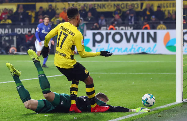 DORTMUND, GERMANY - NOVEMBER 25: Goalkeeper Ralf Faehrmann of Schalke makes a save against Pierre-Emerick Aubameyang of Dortmund during the Bundesl...