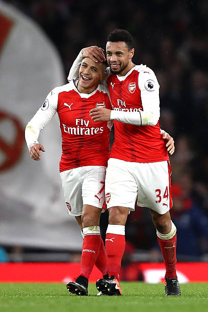 LONDON, ENGLAND - DECEMBER 10: Alexis Sanchez of Arsenal (L) and Francis Coquelin of Arsenal (R) celebrate after Theo Walcott of Arsenal (not pictu...