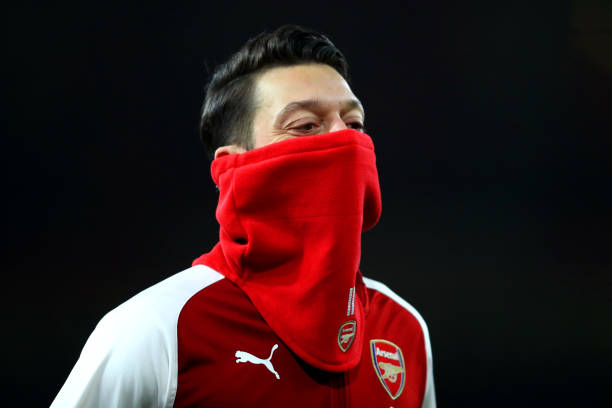 LONDON, ENGLAND - JANUARY 03: Mesut Ozil of Arsenal warms up prior to the Premier League match between Arsenal and Chelsea at Emirates Stadium on J...