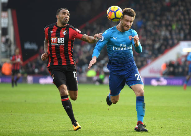 BOURNEMOUTH, ENGLAND - JANUARY 14: Callum Wilson of AFC Bournemouth and Shkodran Mustafi of Arsenal in action during the Premier League match betwe...