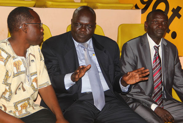 Arsenal 2019 tour destination announced 3 NCS chairman John Bosco Onyik (C) talks to UAF president Dominic Otucet (L) and former world junior champion Julius Achon at Lugogo yesterday. Photo by Ismail Kezaala