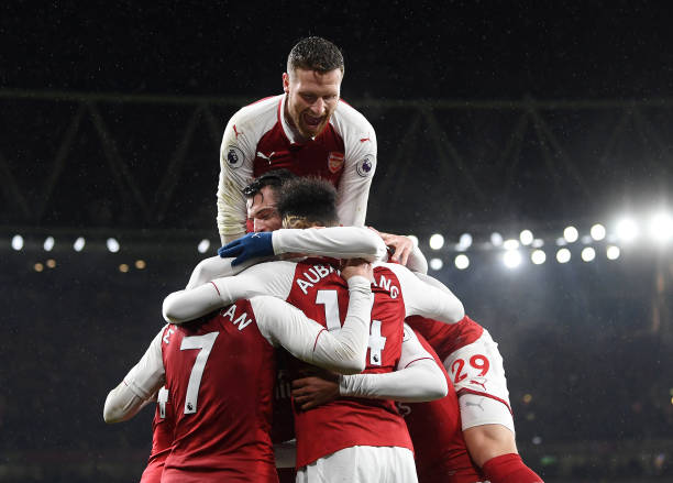 LONDON, ENGLAND - FEBRUARY 03: Pierre-Emerick Aubameyang of Arsenal celebrates after scoring his sides fourth goal with teammates during the Premie...