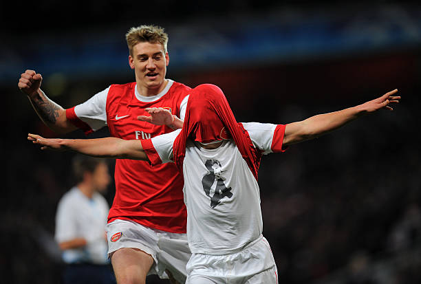 Arsenal's Russian midfielder Andrey Arshavin (R) celebrates after scoring a goal during the Champions League round of 16 first leg football match Arsenal vs FC Barcelona on February 16, 2011 at the Emirates stadium in London. AFP PHOTO / LLUIS GENE
