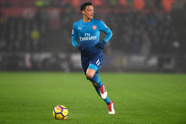 SWANSEA, WALES - JANUARY 30: Arsenal player Mesut Ozil in action during the Premier League match between Swansea City and Arsenal at Liberty Stadium on January 30, 2018 in Swansea, Wales. (Photo by Stu Forster/Getty Images)