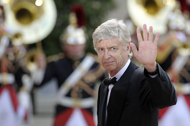 Arsenal's French coach Arsene Wenger waves as he arrive for a state dinner at the Elysee presidential palace in Paris, on June 6, 2014, following the international D-Day commemoration ceremony on the beach of Ouistreham, Normandy, marking the 70th anniversary of the World War II Allied landings in Normandy. AFP PHOTO / FRED DUFOUR 