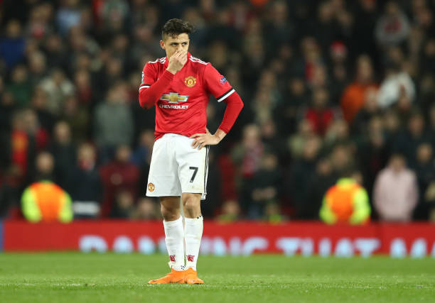 MANCHESTER, ENGLAND - MARCH 13: Alexis Sanchez of Manchester United looks despondent during the UEFA Champions League Round of 16 Second Leg match ...