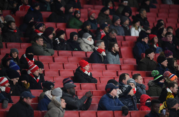 LONDON, ENGLAND - MARCH 01: Fans watch the match with empty seats all around during the Premier League match between Arsenal and Manchester City at Emirates Stadium on March 1, 2018 in London, England. (Photo by Shaun Botterill/Getty Images)