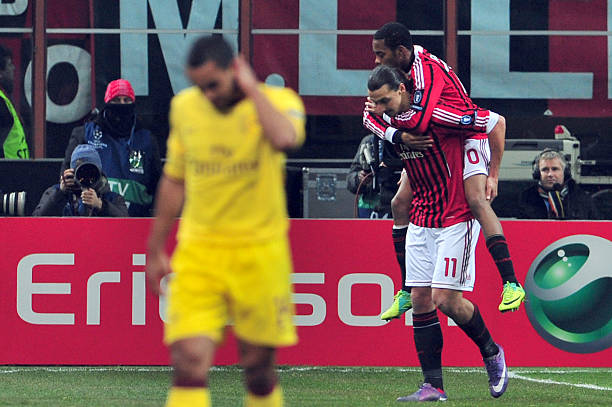 AC Milan's Brazilian forward Robinho celebrates after scoring with AC Milan's Swedish forward Zlatan Ibrahimovic during the UEFA Champions League r...