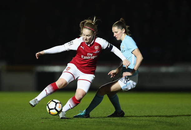 HIGH WYCOMBE, ENGLAND - MARCH 14: Kim Little of Arsenal is challenged by Abbie McManus of Manchester City during the WSL Continental Cup Final betw...