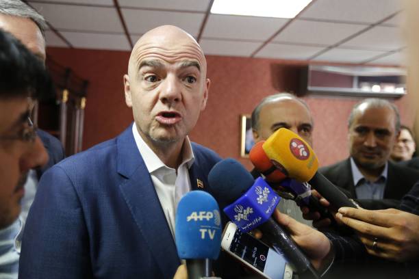 FIFA President Gianni Infantino talks to journalists during his visit to the Iranian capital Tehran on March 1, 2018. / AFP PHOTO / ATTA KENARE 