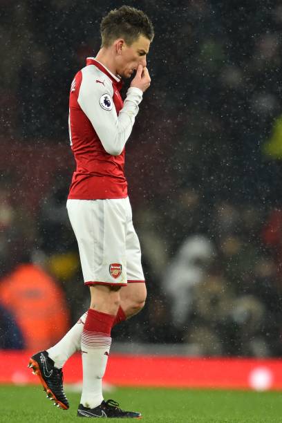 Arsenal's French defender Laurent Koscielny leaves the pitch after the English Premier League football match between Arsenal and Manchester City at...