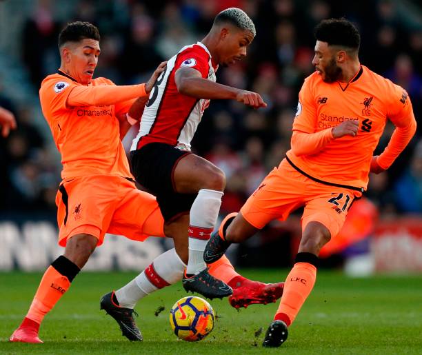 Liverpool eye strong 6ft midfielder 'flattered' by Arsenal interest, Gunners need him 2 Southampton's Gabonese midfielder Mario Lemina (C) is challenged by Liverpool's Brazilian midfielder Roberto Firmino (L) and Liverpool's English midfielder Alex Oxlade-Chamberlain (R) during the English Premier League football match between Southampton and Liverpool at St Mary's Stadium in Southampton, southern England on February 11, 2018. / AFP PHOTO / Adrian DENNIS /