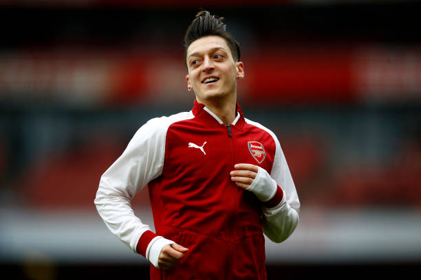 LONDON, ENGLAND - MARCH 11: Mesut Ozil of Arsenal warms up during the Premier League match between Arsenal and Watford at Emirates Stadium on March...