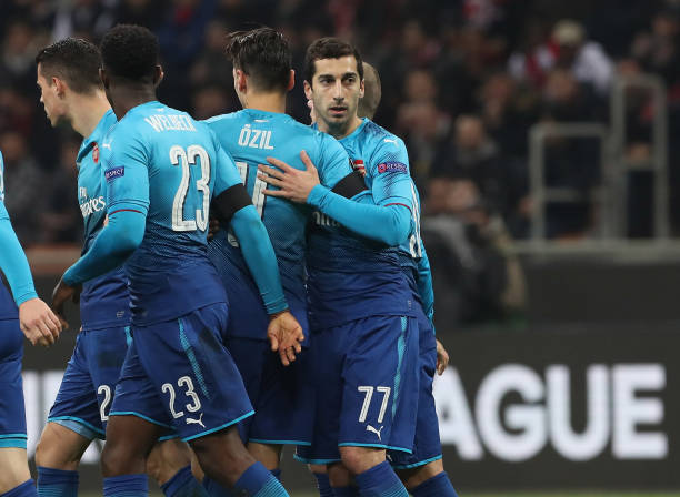 Özil stars in committed Arsenal display: Player ratings v Milan 4 MILAN, ITALY - MARCH 08: Henrikh Mkhitaryan #77 of Arsenal celebrates with his team-mates after scoring the opening goal during UEFA Europa League Round of 16 match between AC Milan and Arsenal at the San Siro on March 8, 2018 in Milan, Italy. (Photo by Marco Luzzani/Getty Images)