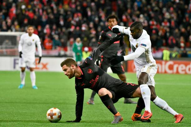 Arsenal's Shkodran Mustafi (L) and Ostersund's Ken Sema vie for the ball during the UEFA Europa League round of 32, first leg football match of Ostersund FK vs Arsenal FC on February 15, 2018 in Ostersund, Sweden. / AFP PHOTO / TT NEWS AGENCY / Robert HENRIKSSON / Sweden OUT