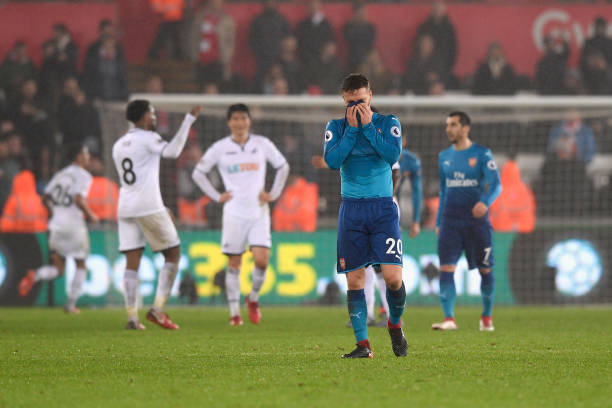 SWANSEA, WALES - JANUARY 30: Shkodran Mustafi of Arsenal looks dejected after the Premier League match between Swansea City and Arsenal at Liberty Stadium on January 30, 2018 in Swansea, Wales. (Photo by Stu Forster/Getty Images)